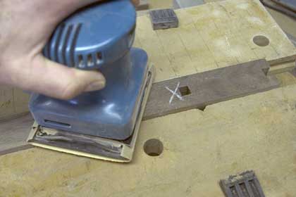 Sanding the vertical uprights